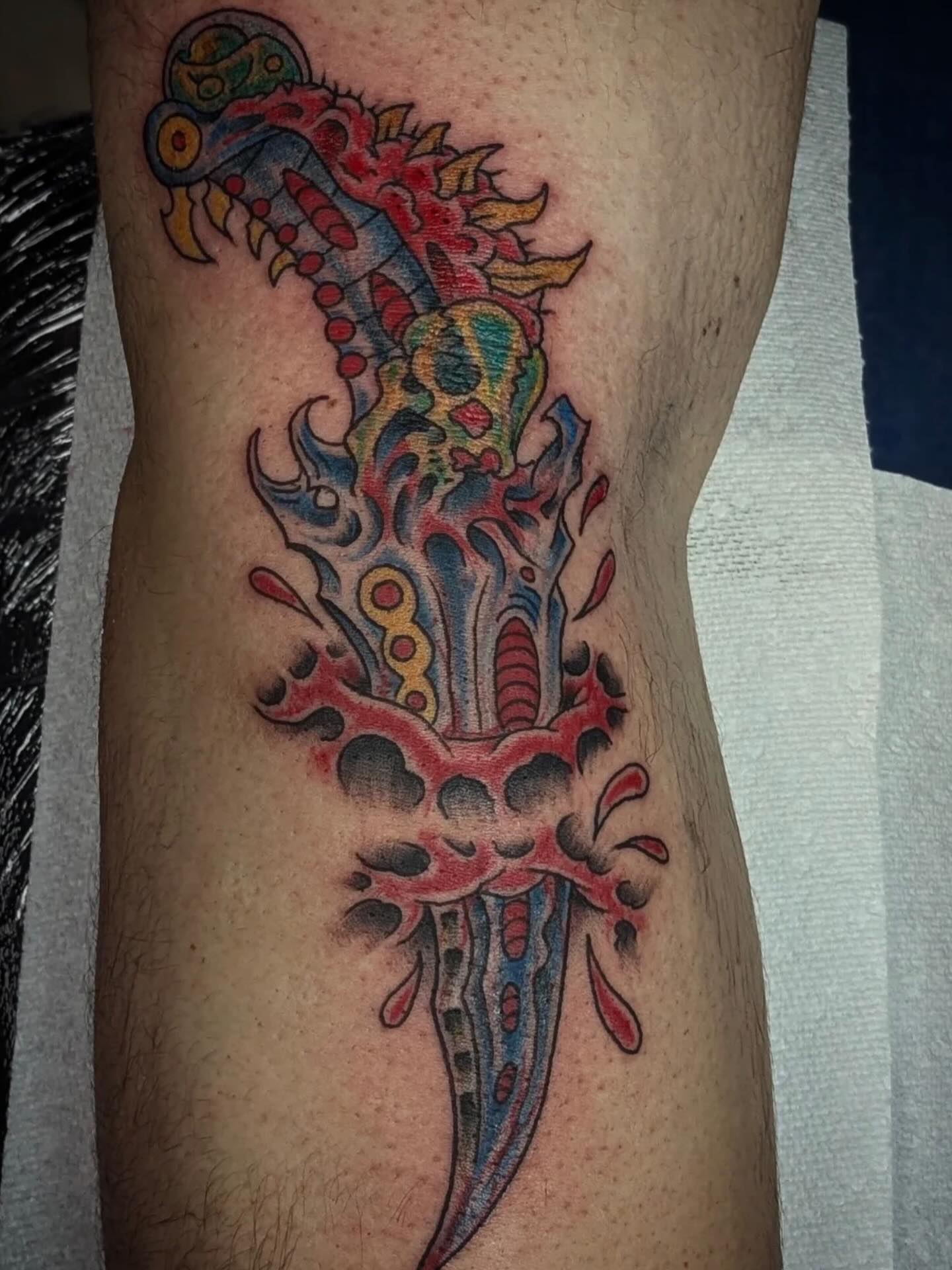 Color ornamental dagger tattoo